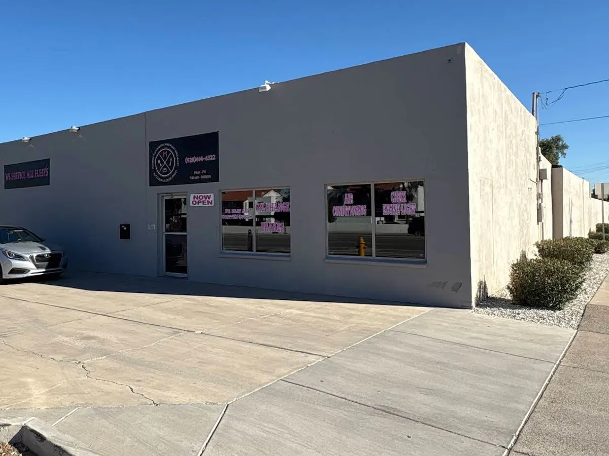 Monroe Automotive And Fleet Specialists shop front with its sign and window ads in Chandler, AZ